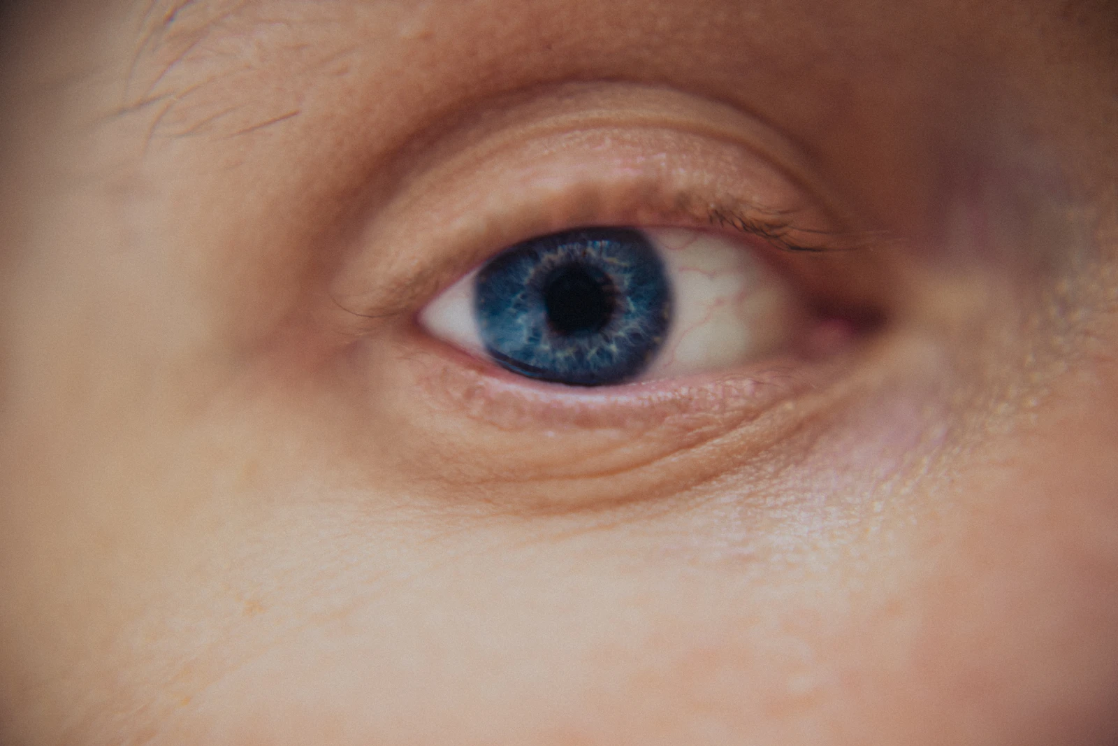 Close-up of a bright blue human eye