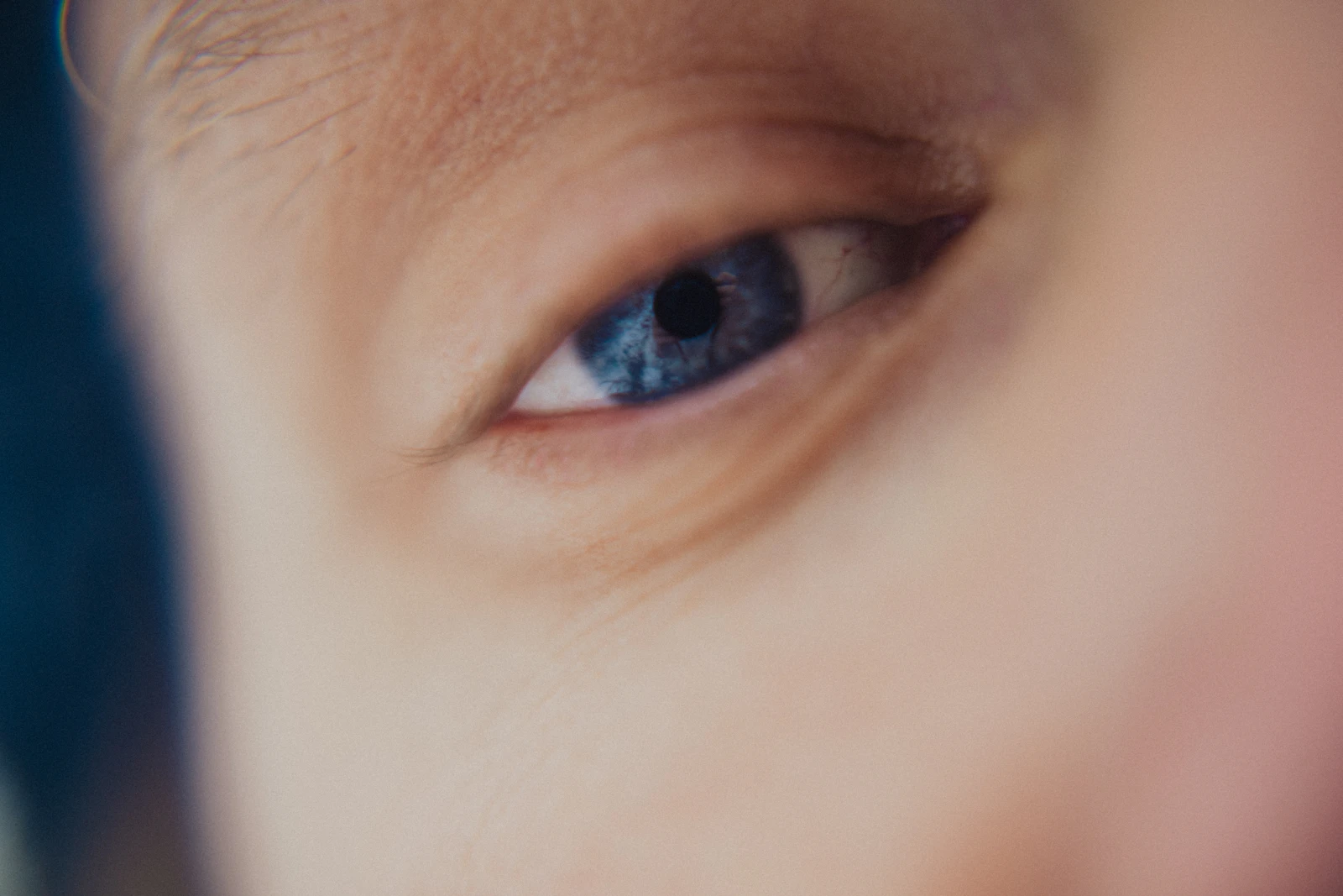 Close-up of a blue eye with a dark pupil